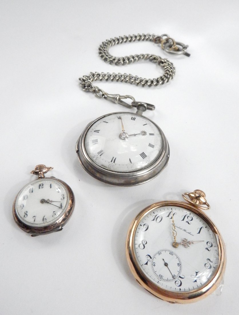 Three Vintage Pocket Watches: Comprises: 1.) Benedict Brothers gold-filled 15 jewel watch. 2.) Silver pocket watch with starburst hour hand. 3.) Small Continental silver watch with engraved inscription inside case in French. None