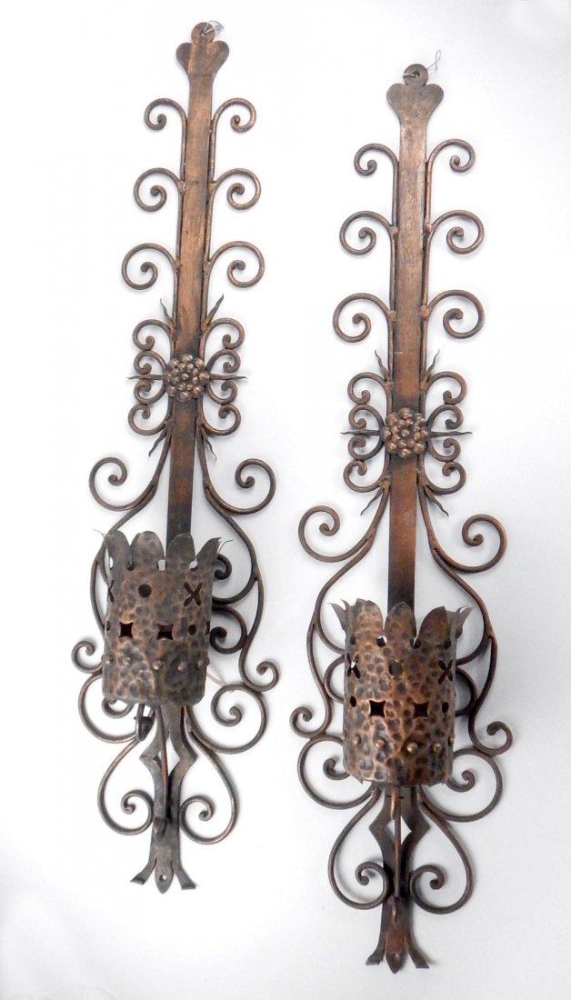 Pair of Gothic Candle Sconces: Pair of hammered decorated iron sconces. [9 1/2" L x 41" H]. In good condition.