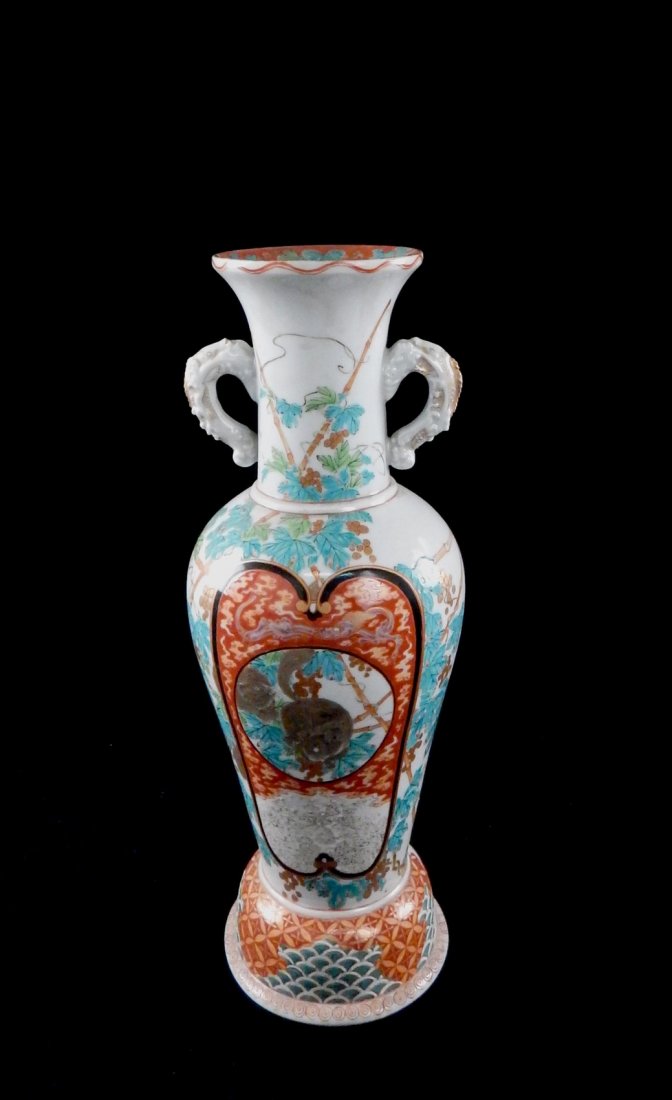Vintage Chinese Squirrel Vase: Colorful hand-painted porcelain vase with central reserve depicting two squirrel eating berries among leafy bamboo shoots. Bears fish-form handles and calligraphic marks on bottom. Wear to gilt accent