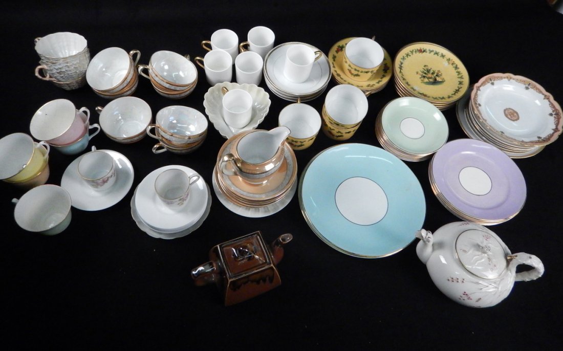 Group of Assorted Dinnerware: Mixed group of teacups with saucers, teapot, and creamer. Includes Coalport, Belleek, Noritake, and others. Conditions vary, in overall good condition.