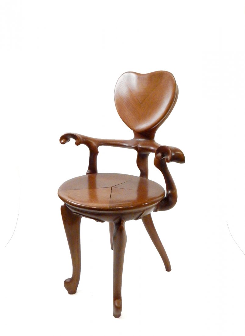 Antoni Gaudi - Calvet Armchair: Calvet chair, carved oak. Originally designed by Gaudi for the Casa Calvet in 1902. Later production by B. Barcelona design company. [38" x 21" D x 25" W]. Seat has separation due to seasonal humidity