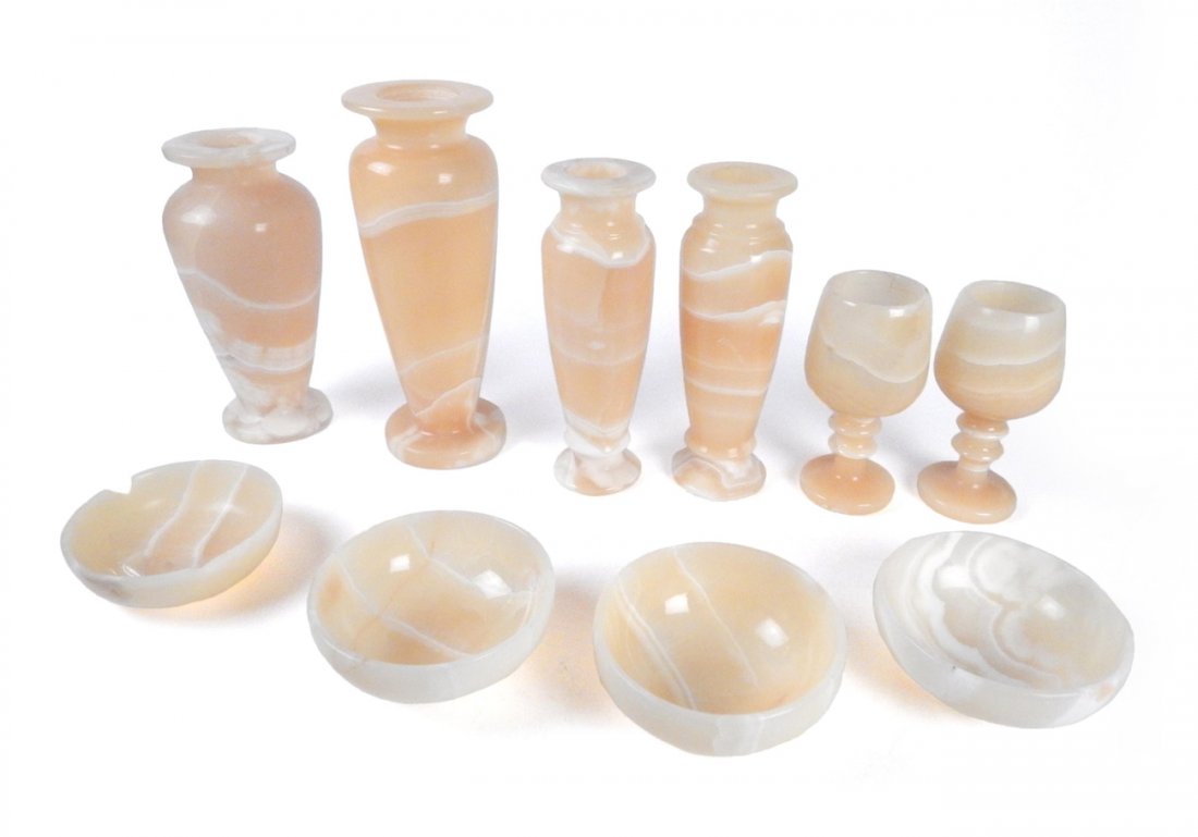 Nine Egyptian Alabaster Vessels: Comprises: Four vases [9 3/4" H, 8 1/4" H, and pair 8 3/8" H], two goblets [6" H and 5 3/4" H], and three bowls [4 3/4" Dia x 2" H]. One bowl bears a 3/8" W chip at rim.
