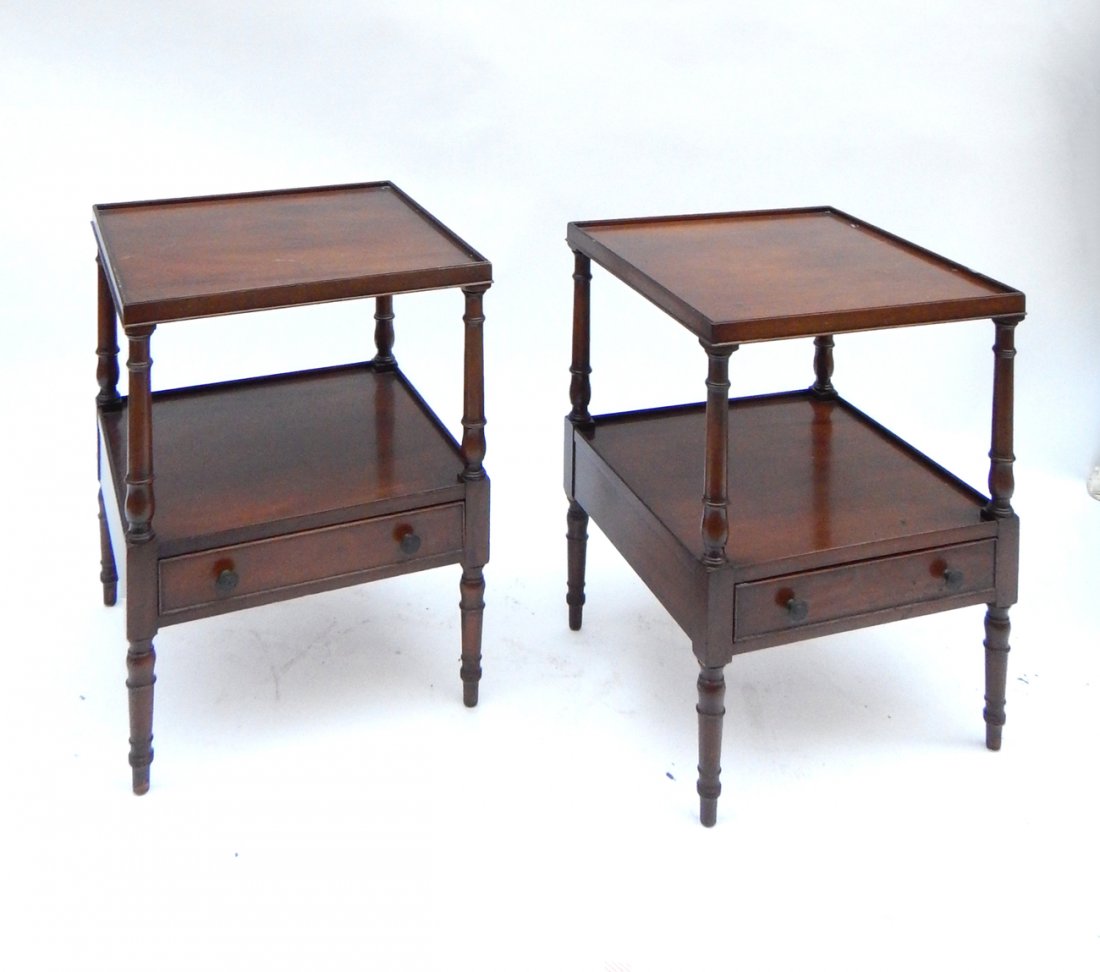 Pair of Kittinger Two-Tier Tables: Pair of mahogany two-tier end tables, each having a single drawer. Made by Kittinger, Buffalo, NY. [18 1/2" x 18 1/2" x 27 1/2" H]. Stains and scratches.