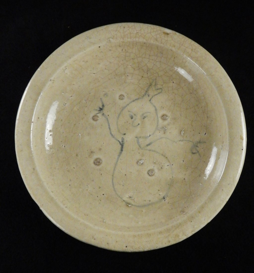 Antique Japanese Earthenware Bowl: Wide shallow glazed earthenware bowl with ring foot. Bears a primitive figure at center. [12 1/4 Dia x 2 3/8" H]. Crazing and kiln imperfections.