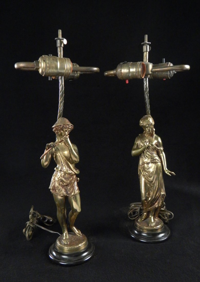 Pair of Bronze Figures as Lamps: Comprises a young shepherd playing flute and maiden in classical dress. Signed "Richard" on base. Both drilled through base at back to be mounted as lamps. [Each: overall 18" H to finial]. Both bear e