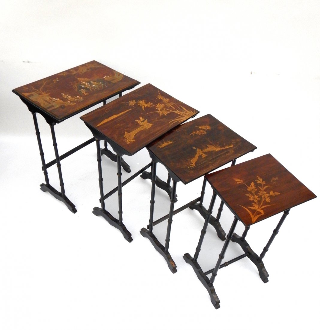 Nest of 4 Lacquered Tables: Featuring japanned surface and black and gold painted legs. [Top: 21 1/2" W x 15" D x 28" H]. Scuffs, scratches, minor losses.