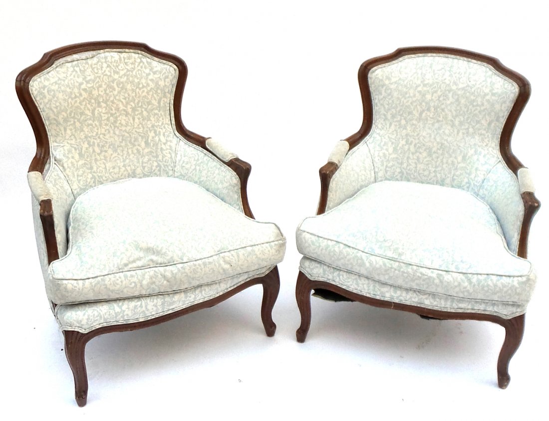 Pair of Louis XV-Style Bergères: Bergères featuring white and blue floral pattern upholstery with removable seat. [27" W x 23" D x 19" to seat; 35" H to top]. Nicks, scratches, some soiling to upholstery.