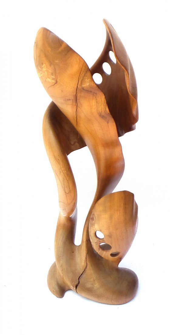 Modern Abstract Mahogany Sculpture: Biomorphic-form mahogany sculpture featuring multiple series of drilled circular holes in a finely sanded surface. [16 1/2" x 16 1/2" D x 47" H]. Very light wear.