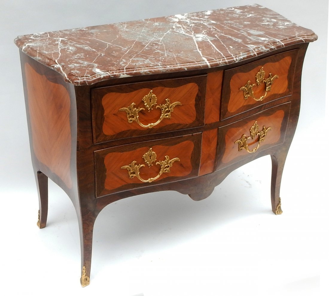 Louis XV-Style Marble Top Commode: Marble top bow front commode with brass hardware. Features two top drawers and one long bottom drawer. [41" W x 18 1/2" D x 32 1/2" H]. Very light wear, in overall good condition.