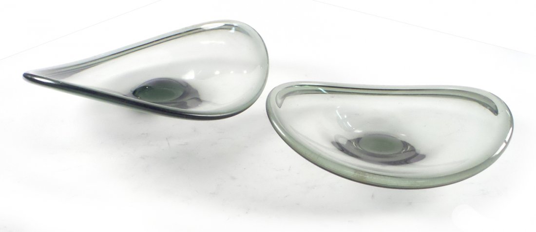Two Holmegaard Glass Bowls: Two clear shaped glass bowls. [11 1/2" x 11" Dia; 15" x 15 1/2" Dia]. Scratches and wear.