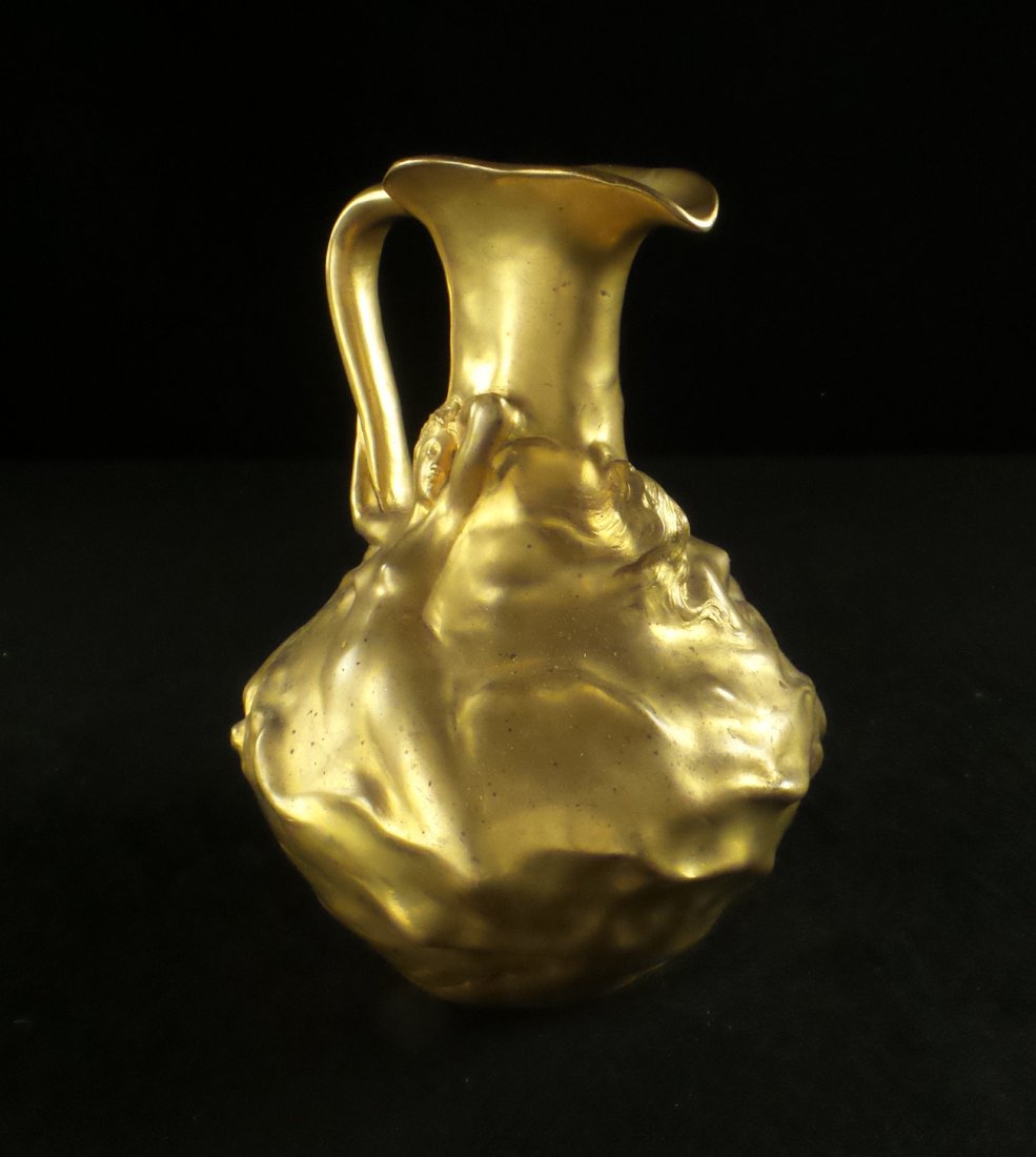J. Garnier, Bronze Ewer: Bronze ewer with two raised female nudes. [8" H x 6" Dia]. In good condition.