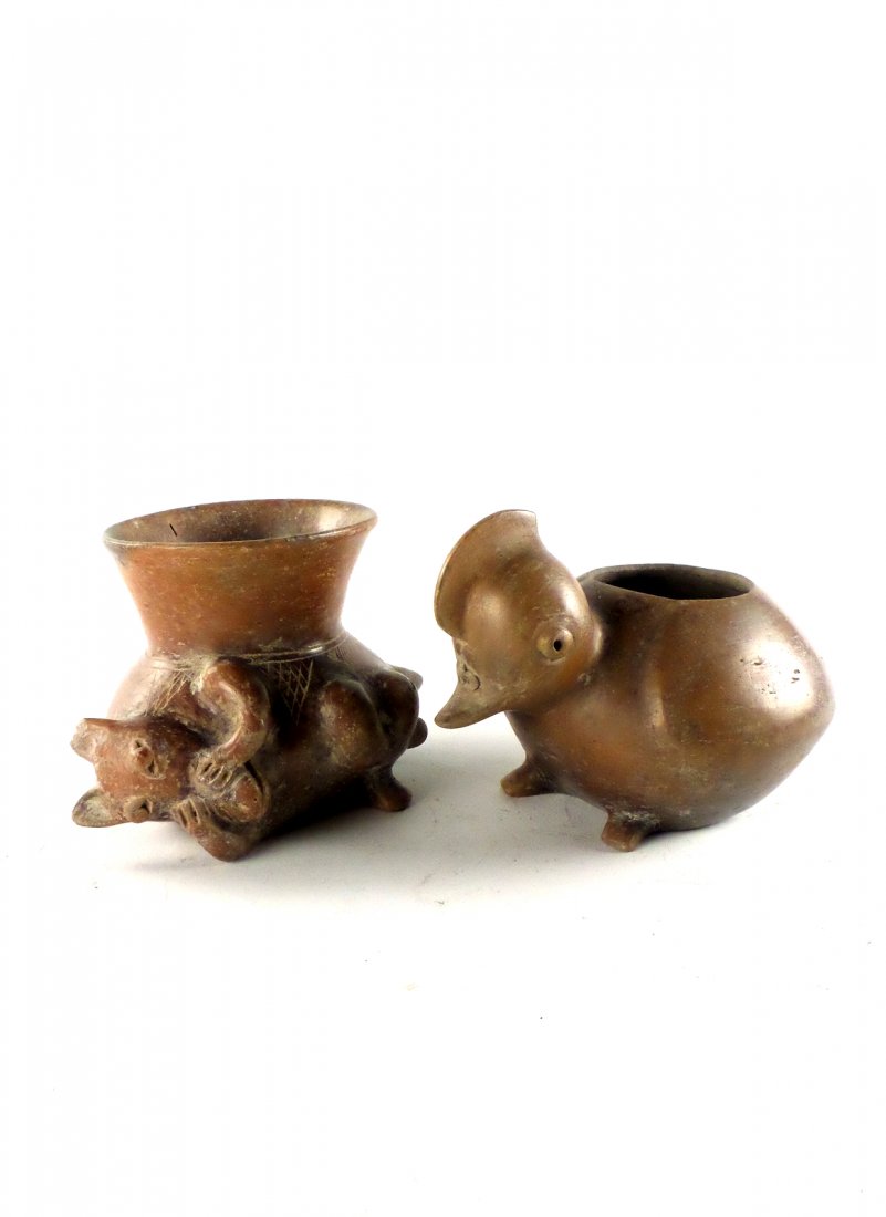 Two Pre-Columbian-Style Animal Vessels: Earthenware vessels comprising a duck vessel and an animal with its hands over its face. [5" to 5 1/2" H]. In overall good condition.