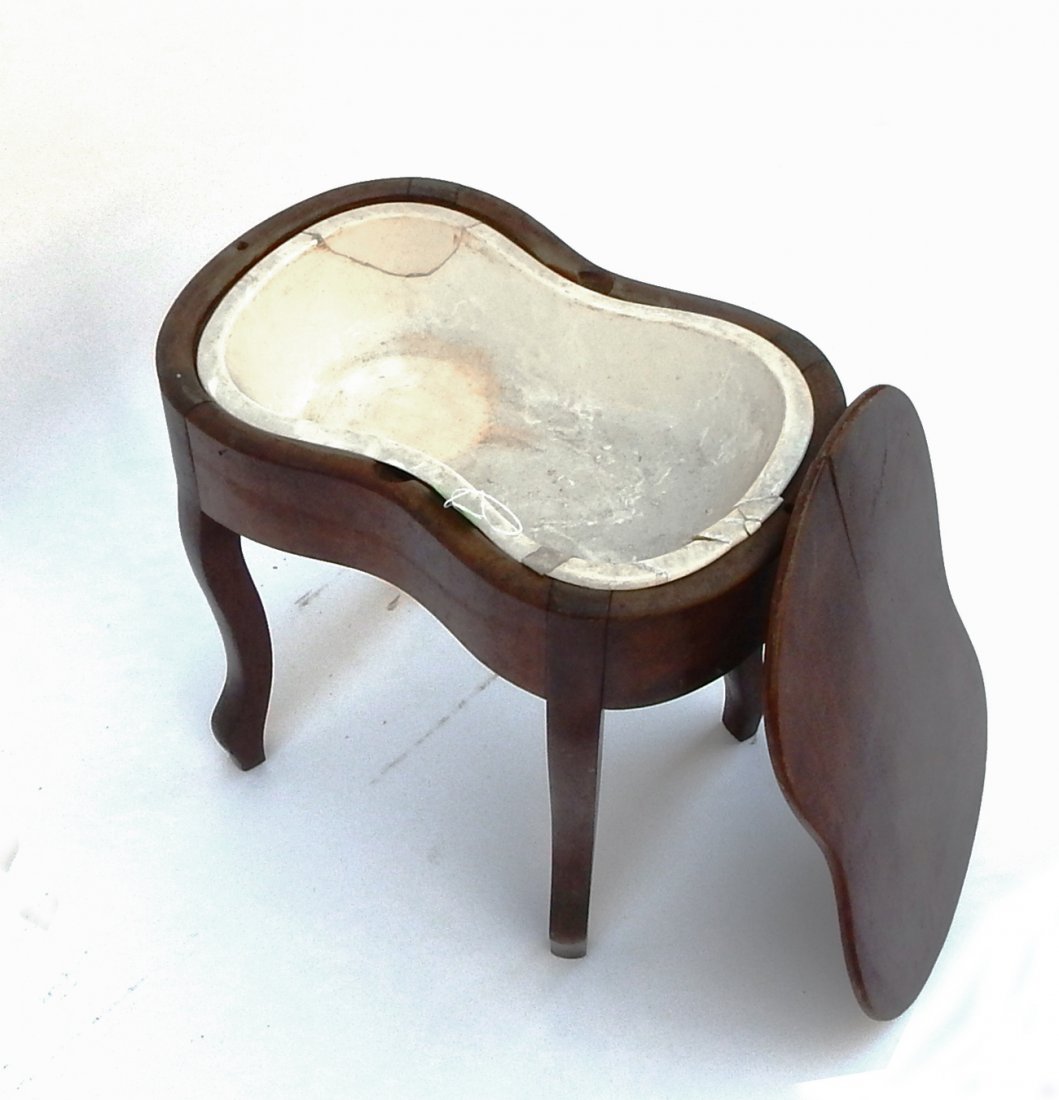 Antique Mahogany Commode: Mahogany commode featuring "figure eight" motif with serpentine legs and porcelain insert. [19 1/2" W x 13" D x 18" H]. Nicks, scuffs, and scratches. Ceramic inserts "as is".