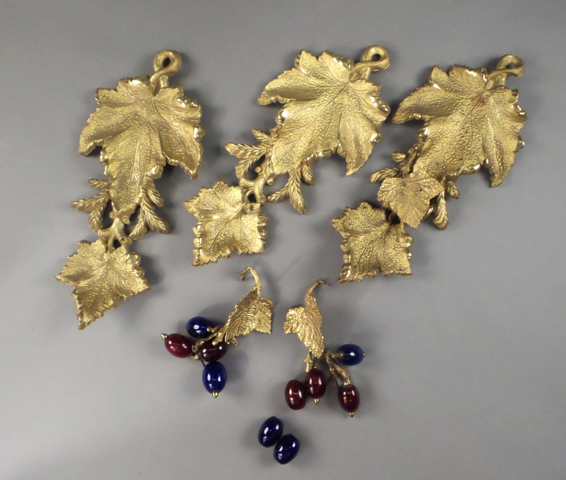 Set of 3 Gilt Metal Curtain Tiebacks: Set of three gilt metal curtain tiebacks with fruit and grapevine design. [13" L approx]. Damages, losses, sold "as is".