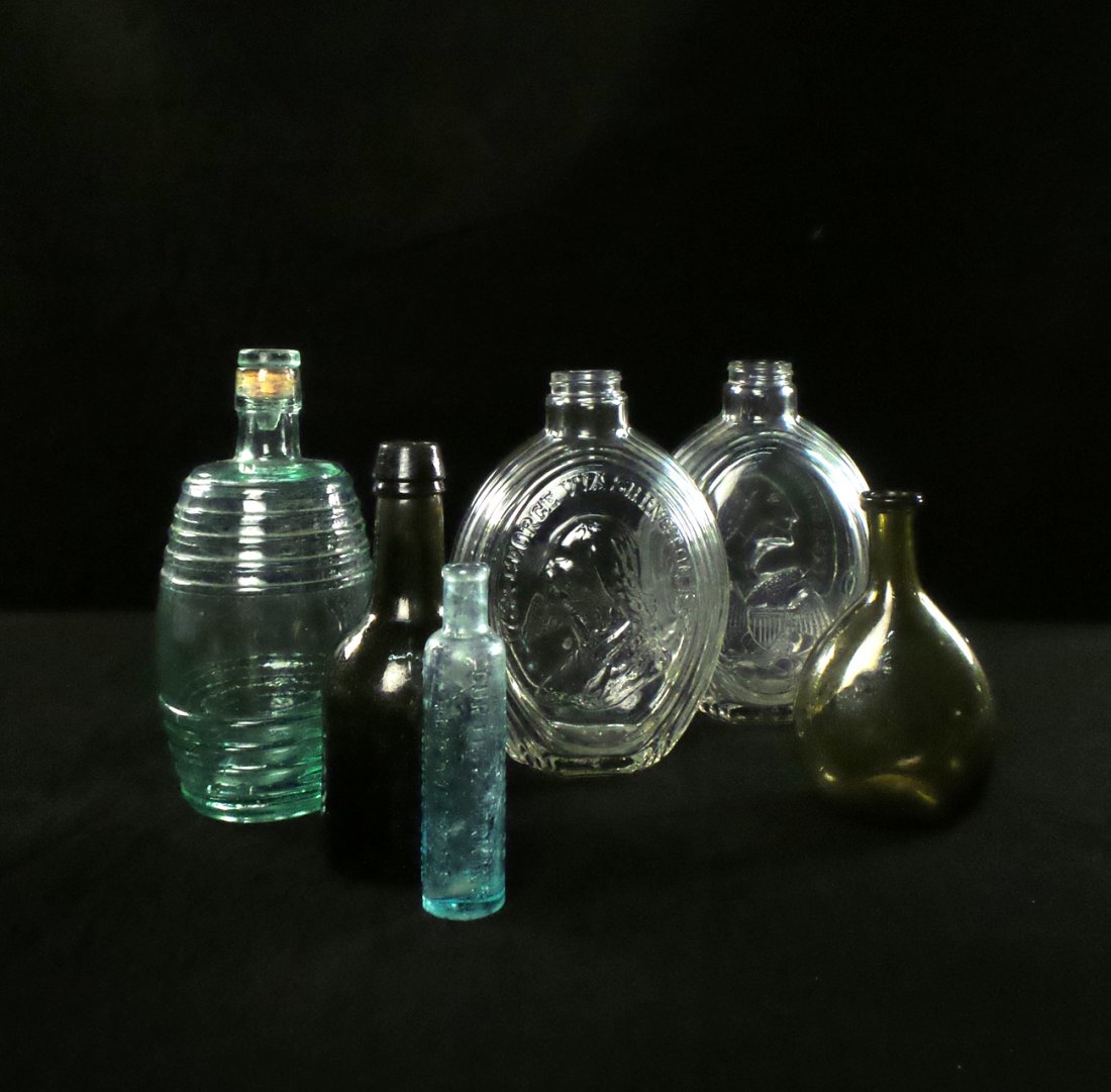 Group of Six Vintage Glass Bottles: 19th and 20th century glass bottles of various manufacture and design. [5" to 8 1/4" H]. Imperfections.