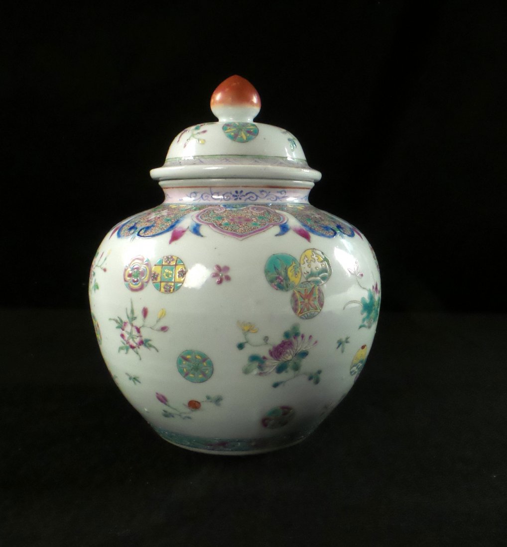 Chinese Enameled Porcelain Ginger Jar: Qing Dynasty enameled porcelain covered ginger jar, delicately ornamented with stylized motifs. [9" H]. Chip to underside of rim.