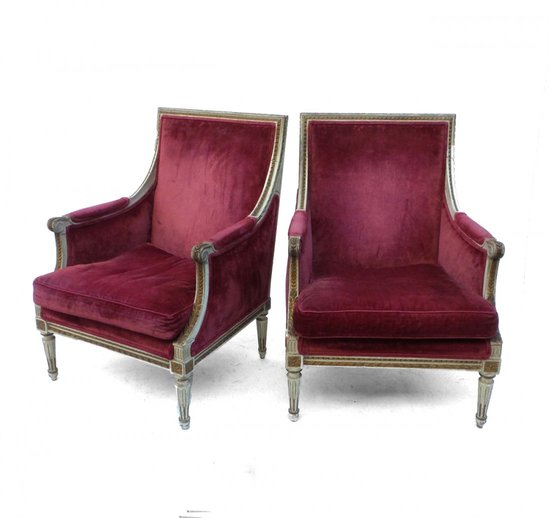 Pair of Late 19th C. French Bergeres: Pair of late 19th century French Louis XVI-style bergeres with crest rails, sloping arms and red upholstery. Both feature richly carved and parcel gilt neoclassical ornament. [Each: 26 1/4" x 26" x 37