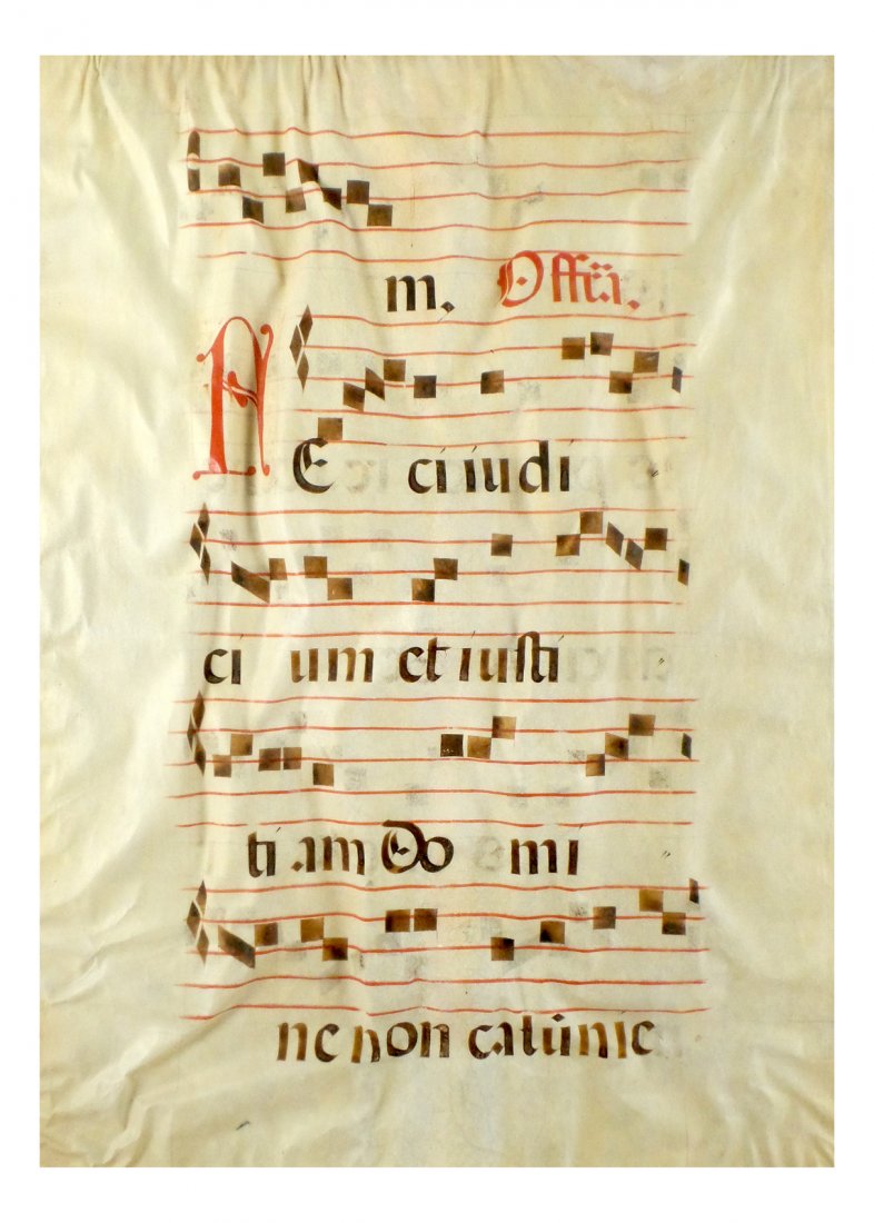 Latin Manuscript on Vellum: Oversize framed liturgical manuscript on vellum. [29" x 22"]. In poor condition.