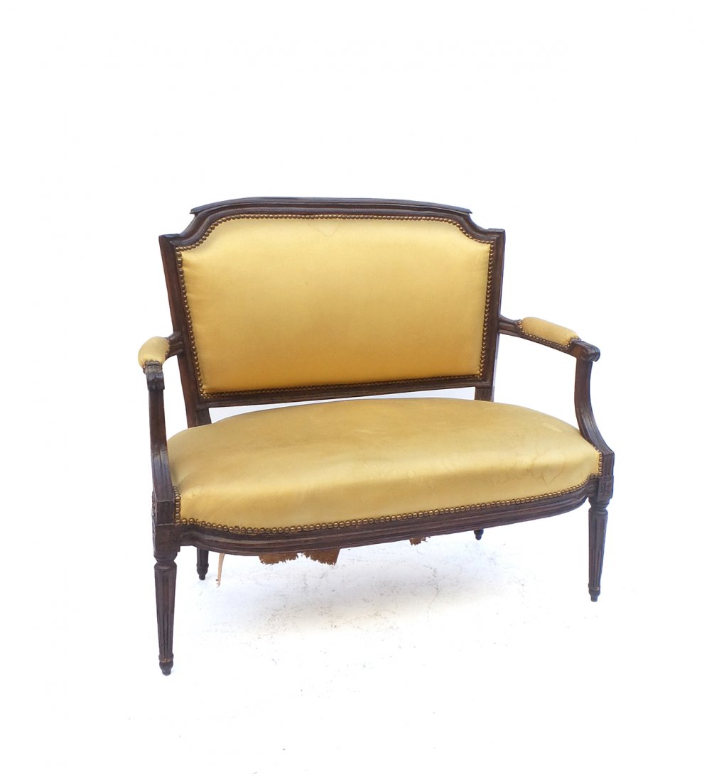 Vintage Louis XVI-Style Loveseat: Mahogany open arm loveseat with yellow silk upholstery. [38 1/2" W x 24 1/4" D x 34 1/4"]. Water stains to upholstery.
