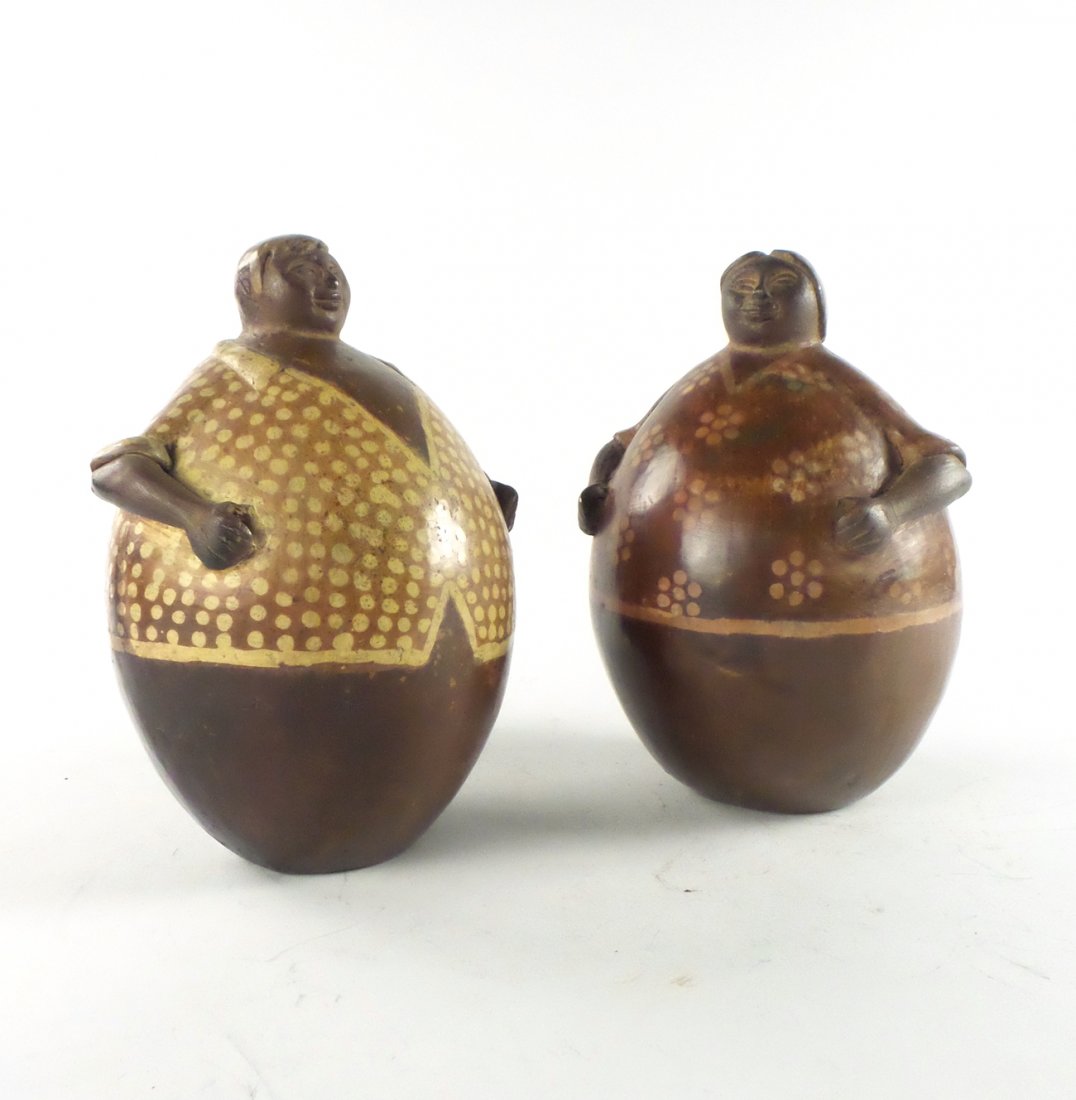 Pair of Pre-Columbian-Style Figures: Two decorated earthenware ball-form figures. [7" H]. In overall good condition.