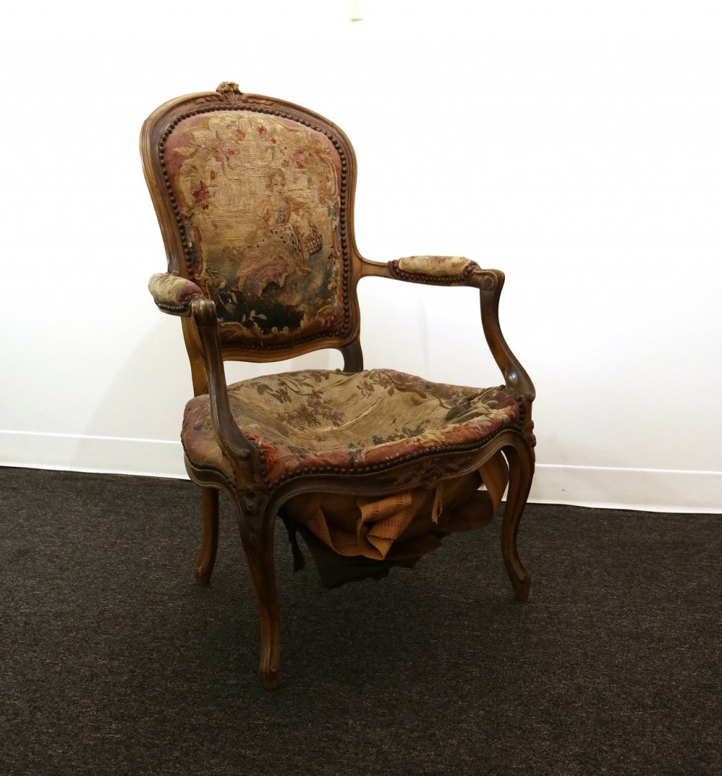 Pair of Aubusson Open Armchair: Pair of 19th century French aubusson upholstered chairs. [24" W x 18" D x 36 1/2" H; 15" H to seat]. En suite with Lot 550.