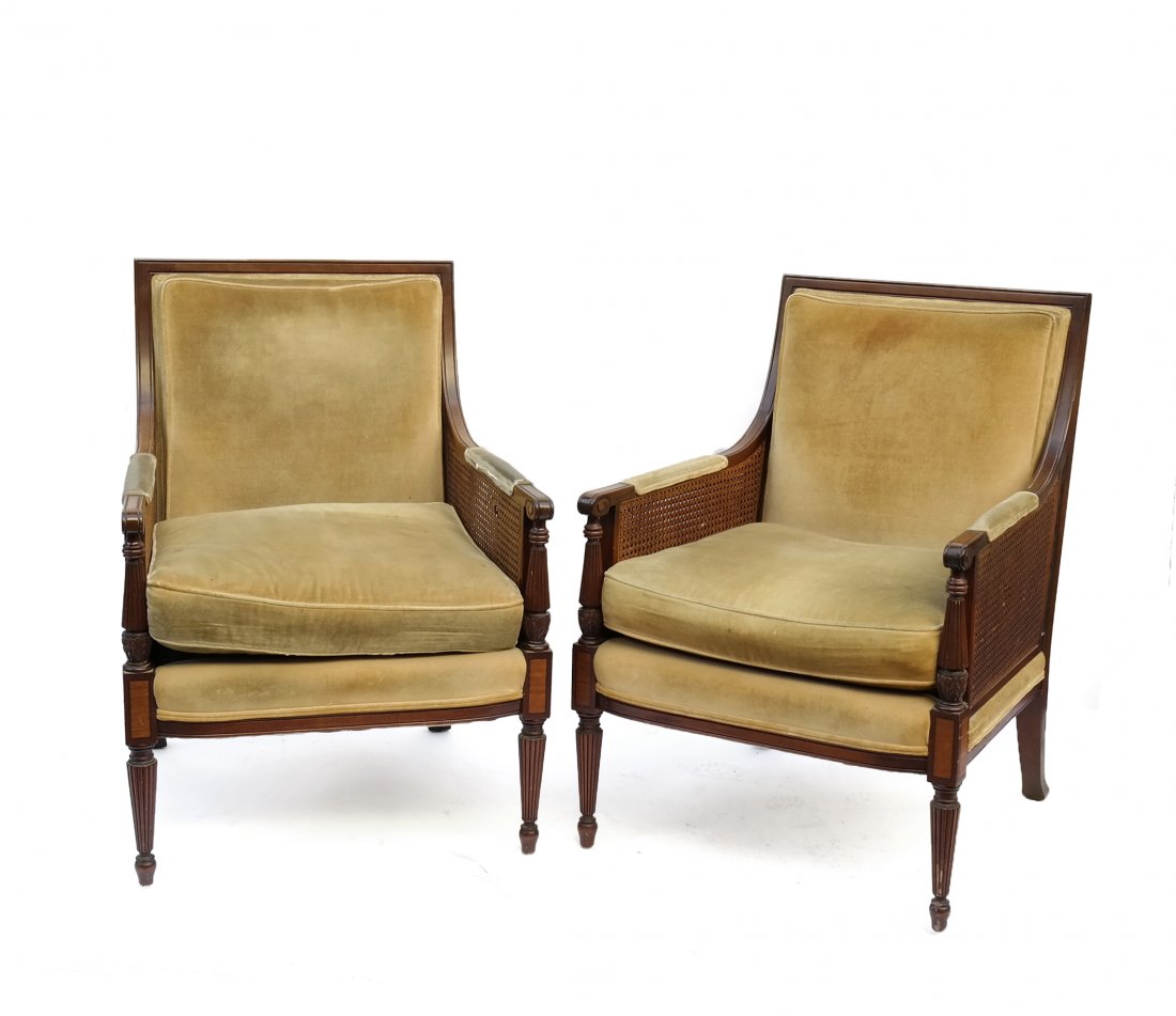 Pair of Sheraton-Style Bergeres: Pair of Sheraton-style mahogany bergeres with cane inserts. [26" W x 26 1/2" D x 36 1/4" H]. Upholstery soiled, cane "as is".