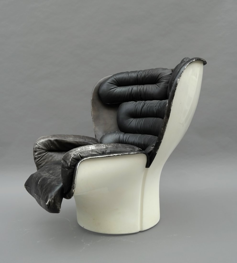 Colombo Chair with Leather Upholstery: Mid-century modern Colombo chair with leather upholstery. [29 1/2" W x 42" D x 36" H]. Good condition, distressed leather worn at the edges. Small split at right arm.