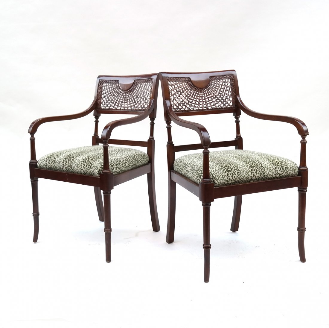 Pair of Mahogany Caned Back Chairs: Pair of mahogany caned back chairs with upholstered seats. [20" W x 18" D x 33 1/2" H]. Good condition.