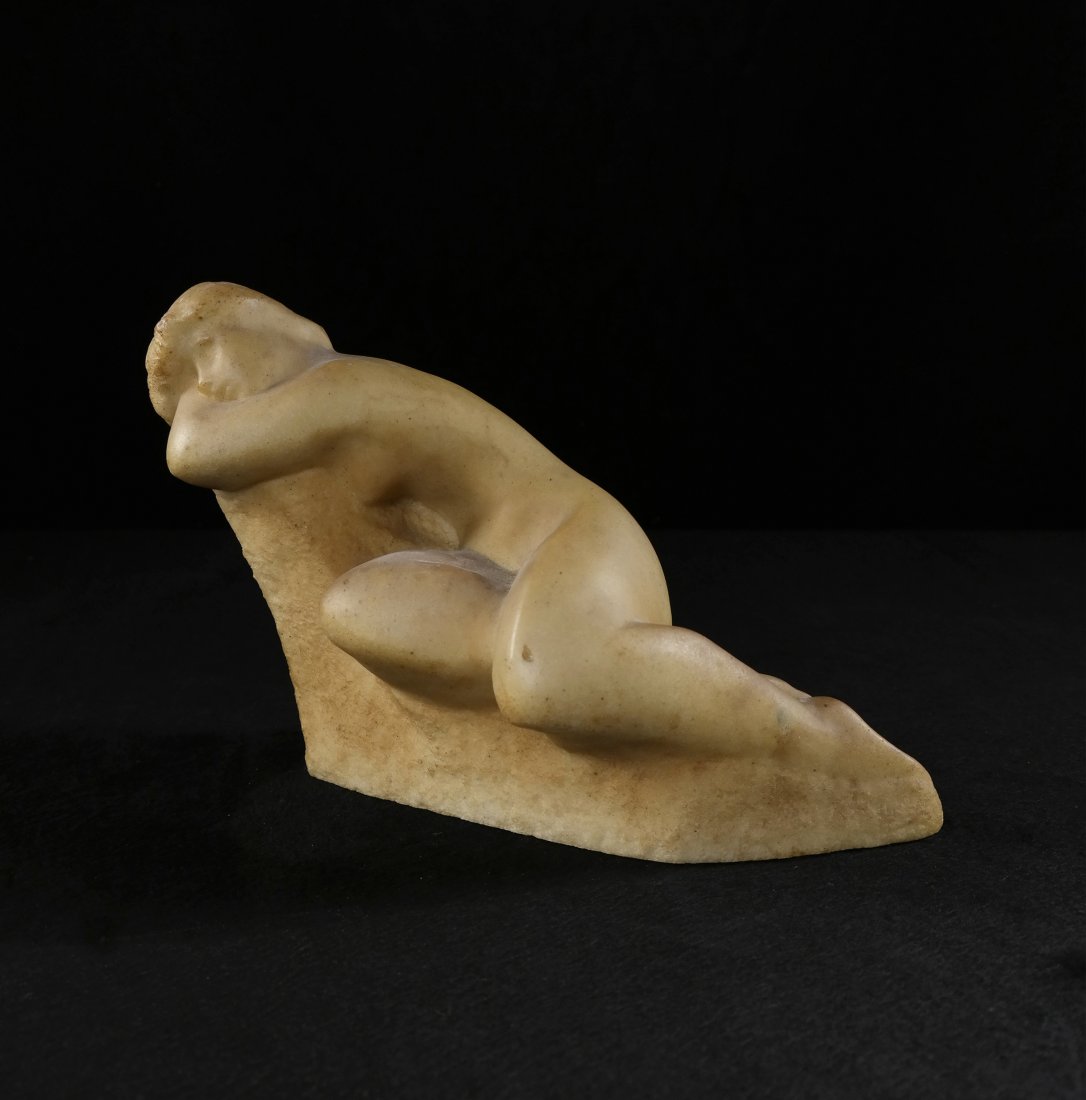 Vincent Glinsky, Female Nude Sculpture: Stone sculpture of a reclining nude woman. [7" H x 11" L]. Worn.