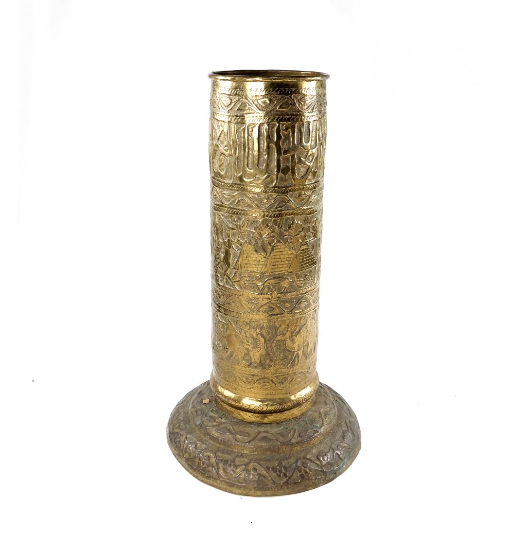 Brass Repousse Umbrella Stand: Brass repousse umbrella stand with Egyptian motif. [12 1/2" Dia. x 26" H]. Good condition.