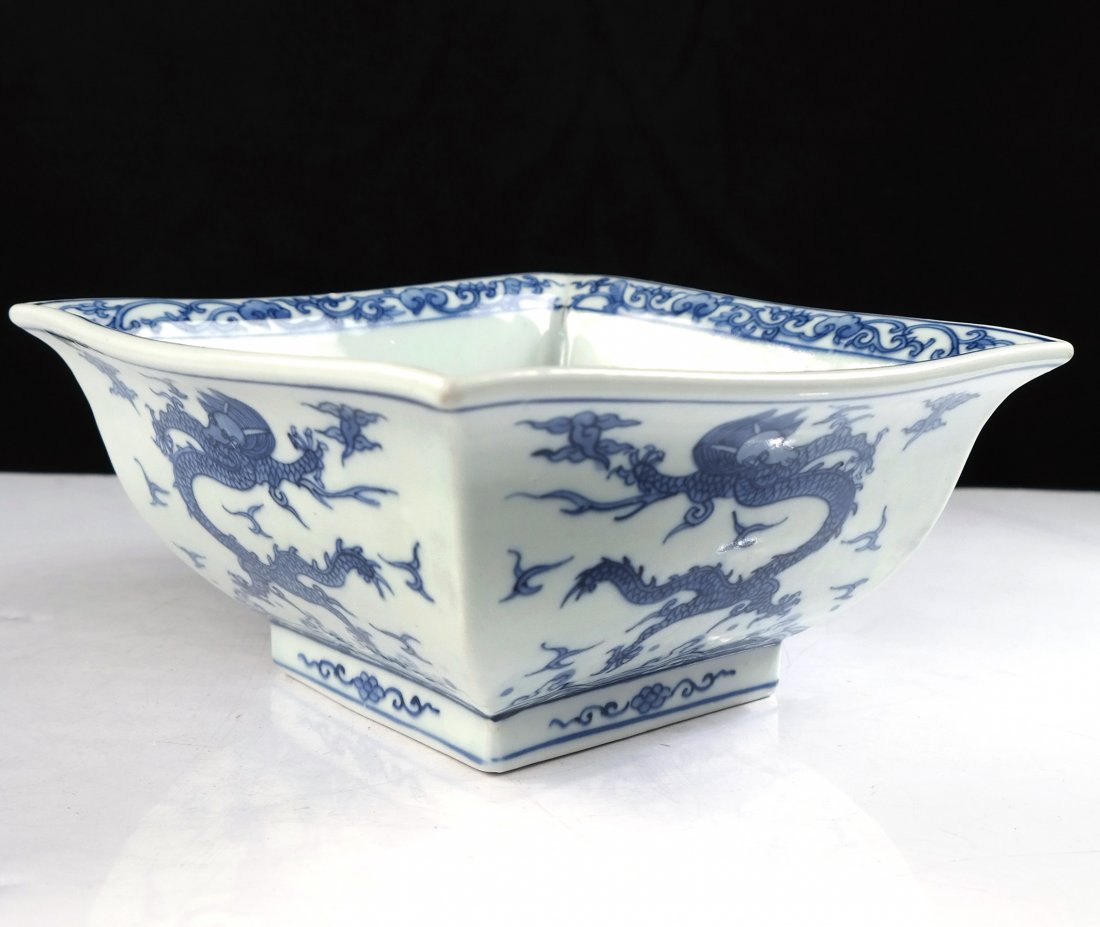 Asian Square-Form Dragon Bowl: Asian square-form blue and white dragon bowl with six character mark. [8 1/2" x 8 1/2" x 4" H]. Two 5" hairline cracks interior only of bowl.