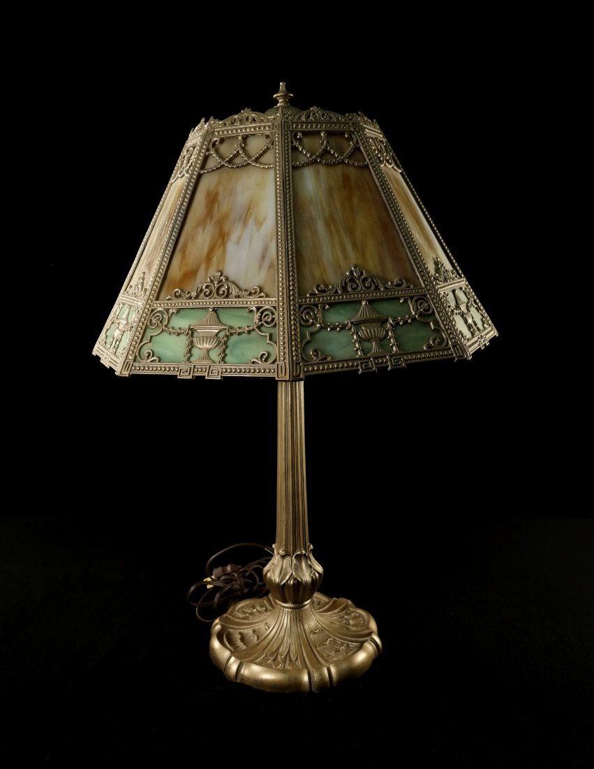 Edwardian Style Art Glass Lamp: Gilt metal base and frame with amber and green slag glass panels. Variations in glass panels. [17 3/4" Dia x 26" H]. Overall good condition.