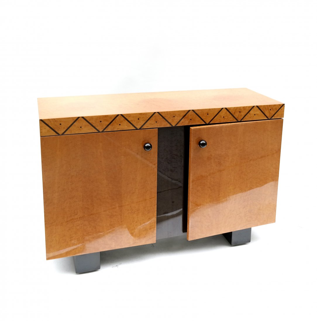 Art Deco-Style Sideboard: Burl maple with inlaid geometric border, two doors and interior shelves. [40 1/2" W x 16 1/2" D x 31' H]. Discoloration to top.