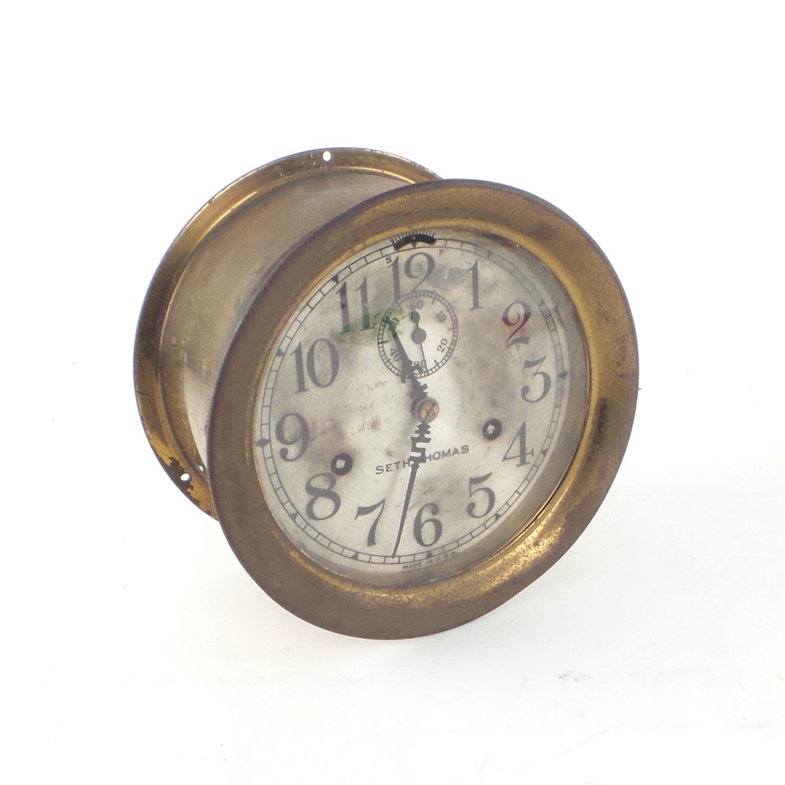 Seth Thomas Clock: Round Seth Thomas clock marked "Made in USA". [7" Dia x 4" D]. In fair condition, soiling, sold "as is". Works not tested.
