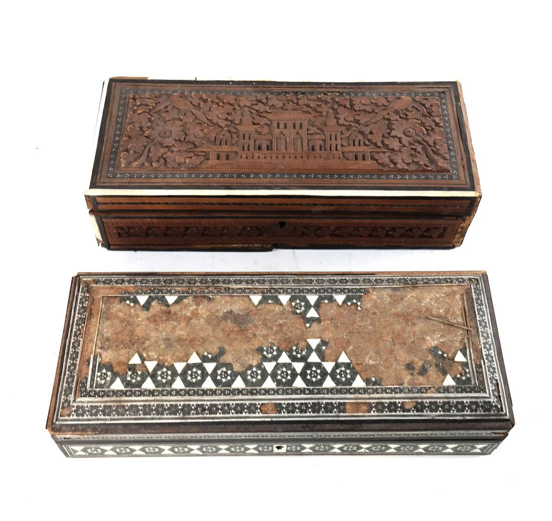 Two Decorative Boxes: Comprising: 1.) Carved wooden box with birds, flowers, and a palace. [3" H x 11 1/2" L x 5" D]. Losses to wood. 2.) Ornate box with ebony geometric overlay. [2 1/2" H x 11 1/2" L x 4 1/2" D]. In poor