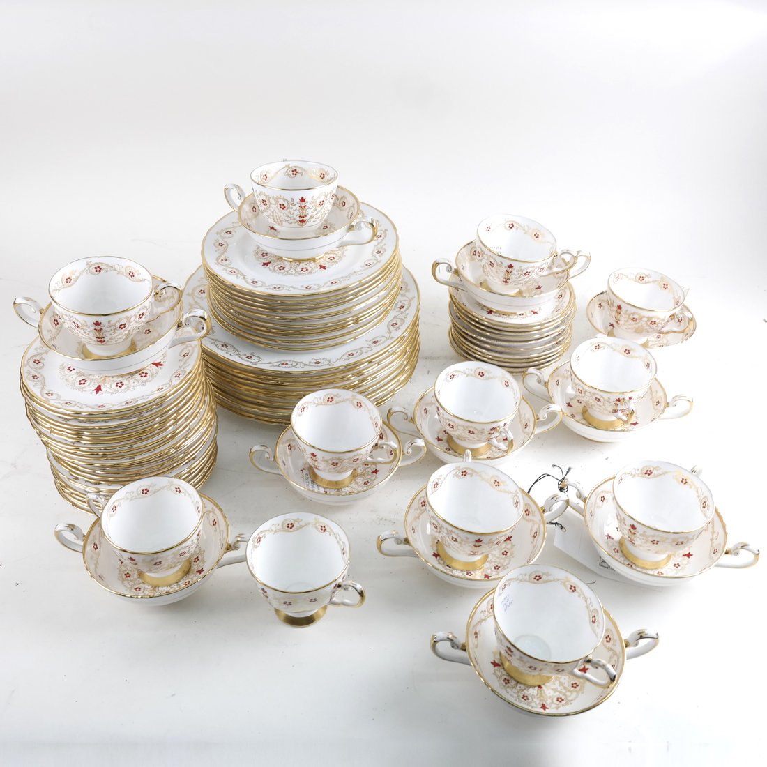 Partial Bone China Dinner Service: 68 pieces of Tuscan bone china, "Richelieu" pattern comprising: 11 double-handled bowl, 12 cups [3" H], 11 salad plates [8 1/2" Dia], 12 dinner plates [10 1/2" D], 11 saucers [5 1/2" Dia], 12 bread pl