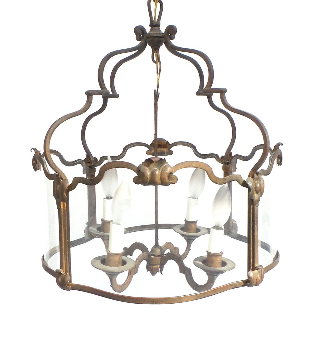 Iron & Glass Four-Light Chandelier: Iron and glass four-light chandelier light fixture. [18" W x 19" H]. Good condition.