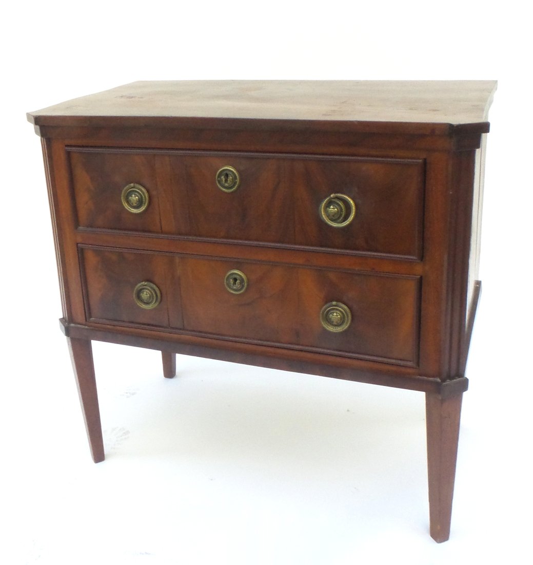 19th Century Two-Drawer Commode: 19th century American mahogany two-drawer, petite commode. [29" L x 16 1/2" D x 27" H]. Splits, wear.