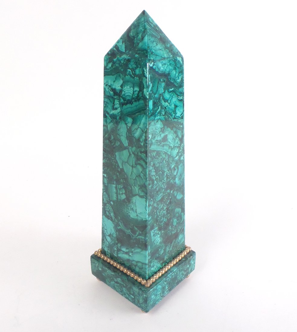 Malachite Obelisk: A malachite obelisk with a gilt ball detail at the base. [Approx: 11" H x 3 1/4" W x 3 1/4" D]. In good condition.