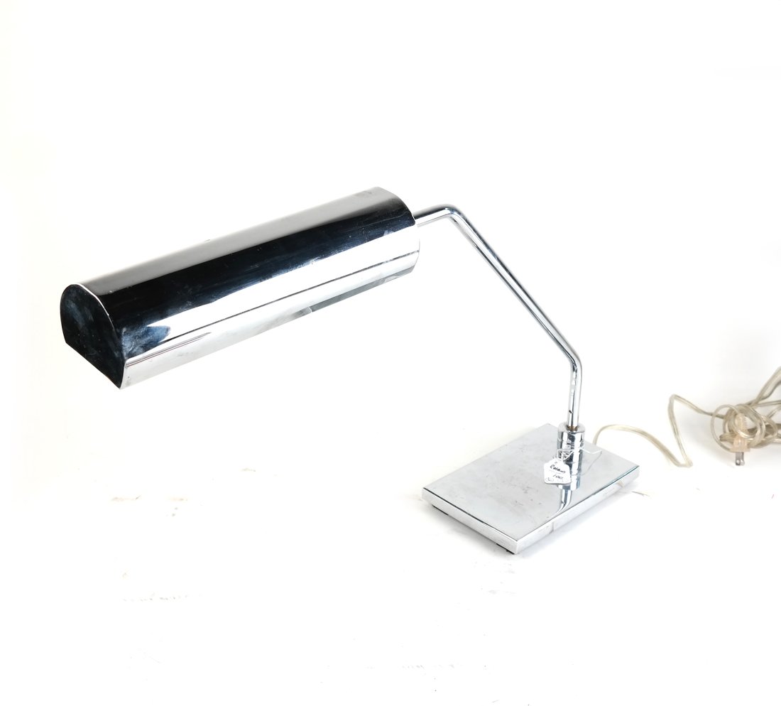 Robert Sonneman Chrome Table Lamp: Robert Sonneman chrome table lamp with a rectangular base and tube form fixture. [15 1/2" H x 24" W x 5 1/4" D]. Scratches on the body from use. Wear appropriate with age.