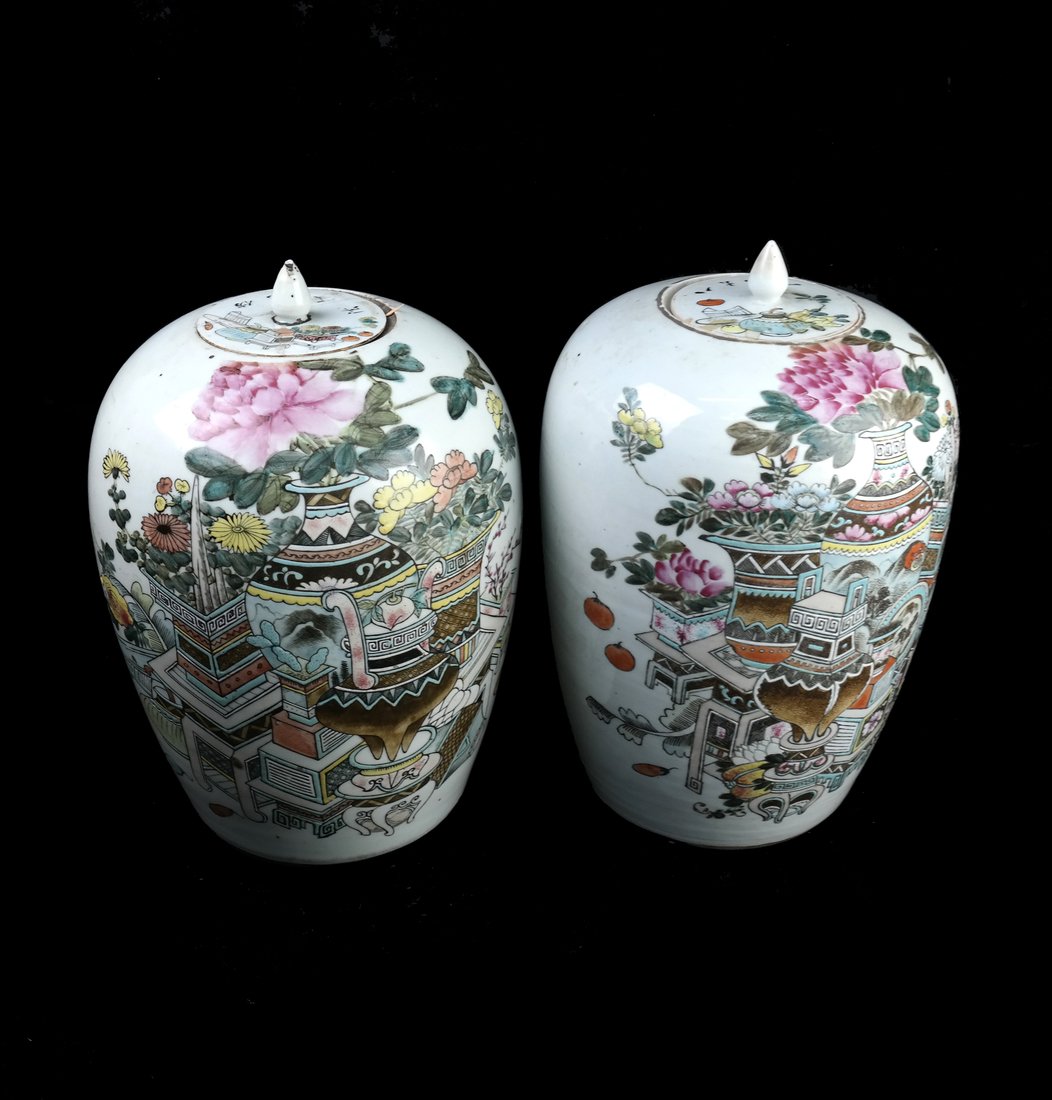 Pair of Chinese Ginger Jars: Pair of 20th century Chinese famille rose style porcelain-covered ginger jars. Each enameled with "one thousand antiques" pattern. [ 12 1/2" H x 9" Dia]. Some flakes to enamel, one cover repaired and