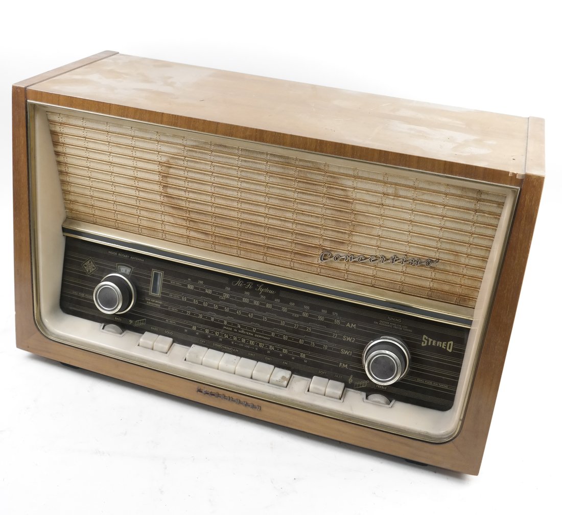 Telefunken Concertino Radio: Telefunken "Concertino" radio. Wood case. [15" H x 24" W x 10 1/2" D]. Sold as is.