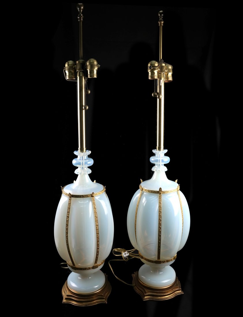 Pair of Venetian Glass Table Lamps: Pair of 20th century Venetian opaline glass table lamps with gilt bronze/ metal mounts. [31 1/2" H; Greatest Dia.: 10" Dia.]. Each in overall good condition.