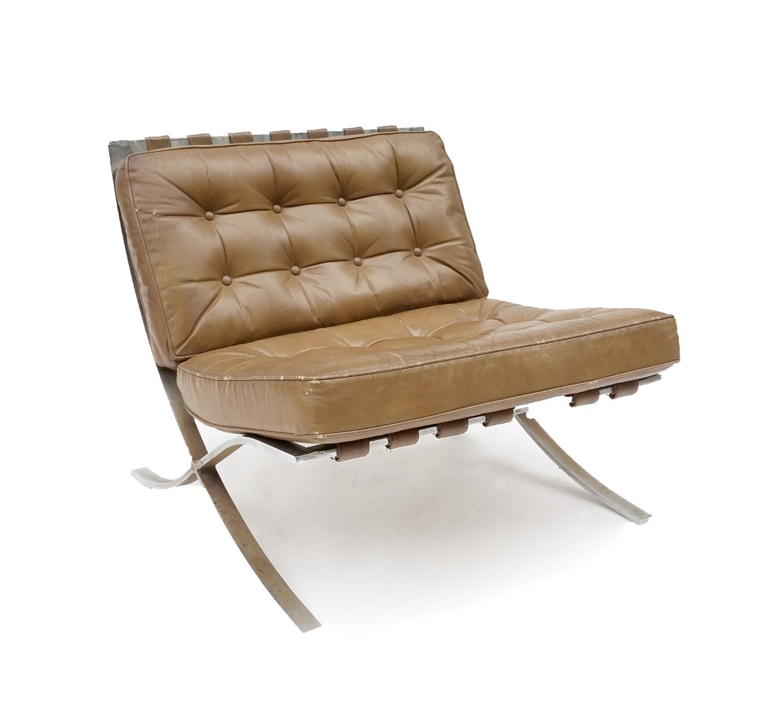 Chrome & Pleather Barcelona-Style Chair: Barcelona-style chair with metal frame and brown pleather upholstery, featuring strap supports and tufted pleather cushions. [29" H x 21" W x 23" D]. Pleather cushion torn, scratched. Surface grime on