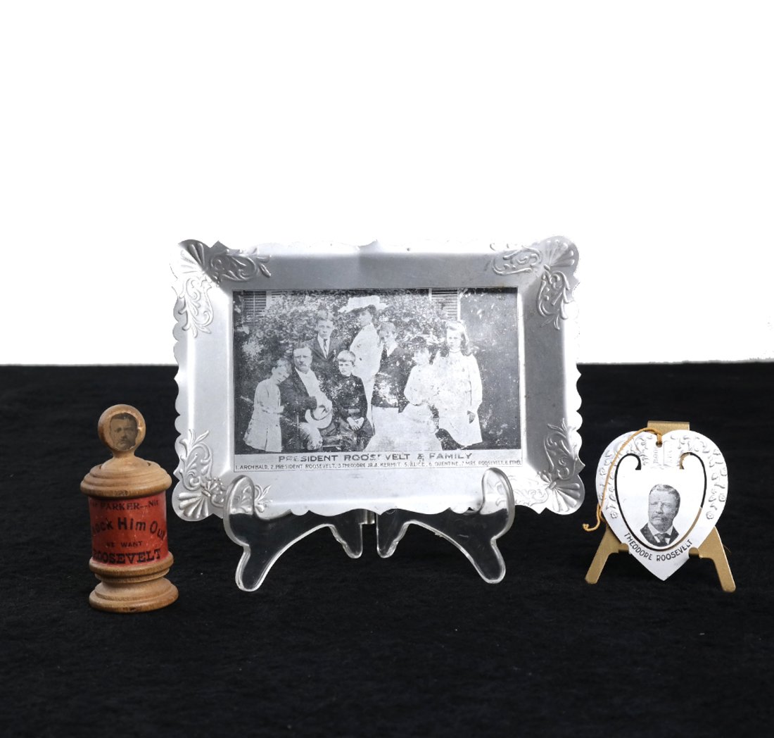 T. Roosevelt Novelty Toy, Tin Bookmark, & Pin Tray: Comprises: 1.) 1904 campaign novelty wood toy manufactured by the Scientific toy Company of New Haven, CT. "Knock Him Out We Want Roosevelt". Toy has likeness of Roosevelt with spring mechanism. 2.) P