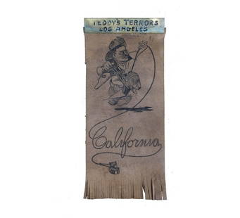 Theodore Roosevelt "Teddy's Terrors" Leather Ribbon: Leather ribbon with fringe bottom. Features a detailed engraved caricature of Roosevelt in "Rough Rider" regalia straddling a bear cub while lassoing a Teddy Bear. Lasso rope coils to spell "Californi