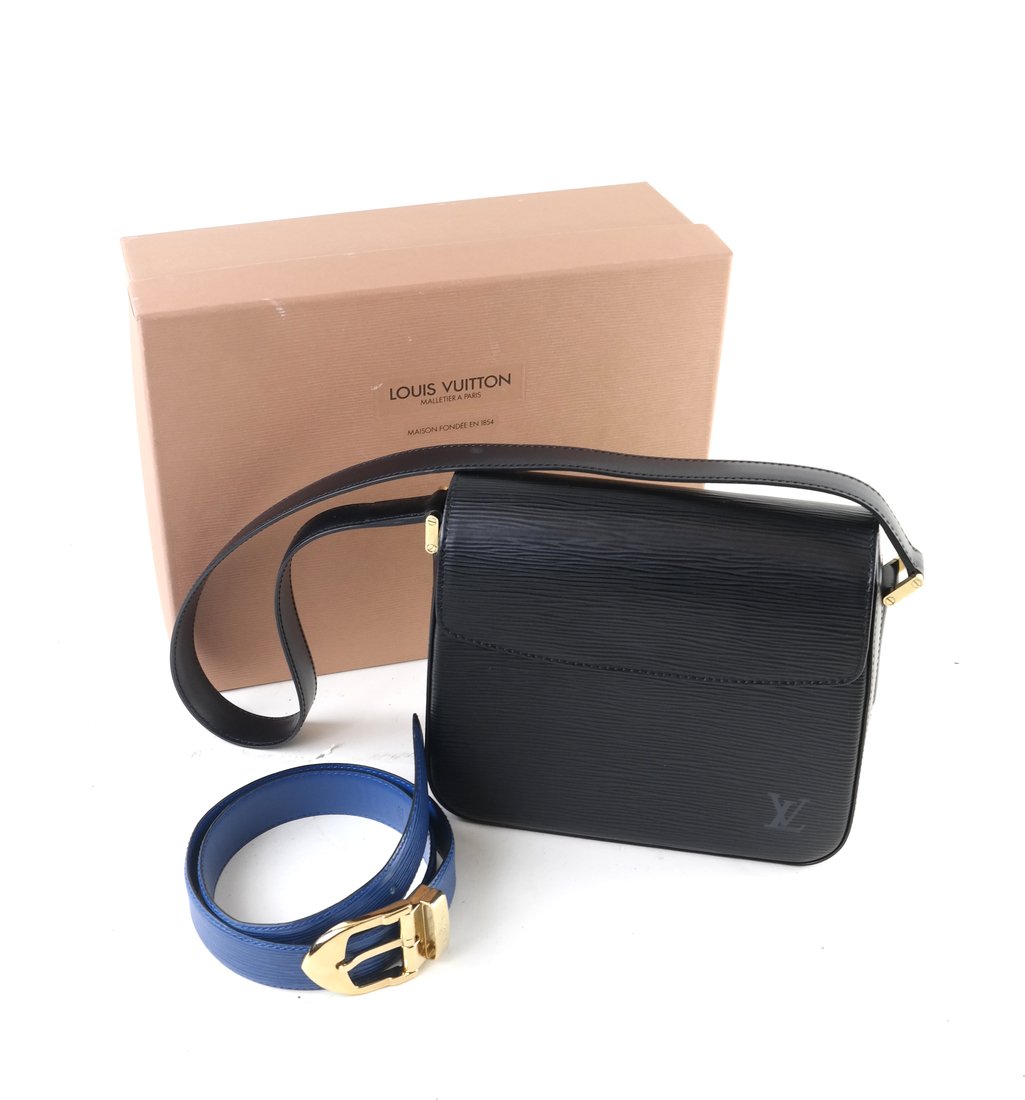 Louis Vuitton Handbag and Belt: Louis Vuitton stamped black leather handbag and similar blue leather belt. Each stamped "Louis Vuitton/Paris/Made in France." [Belt length: 34"]. Each with some minor wear overall.
