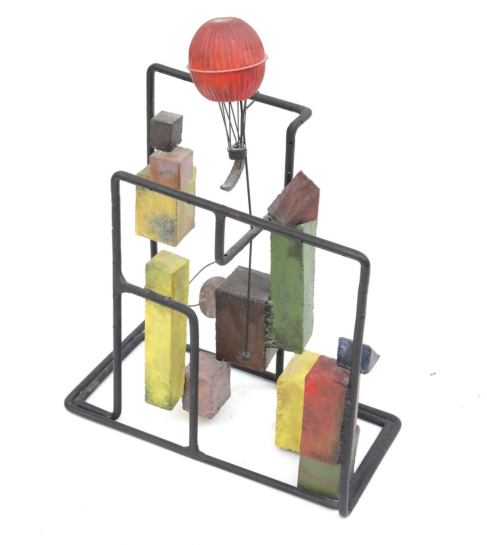 After David Smith- Metal Sculpture: Features various blocks representing buildings with a red painted hot air balloon. [25" H x 20" W x 11" D]. Rust and wear.