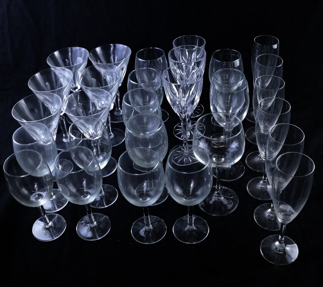 Twenty-Nine Pieces of Crystal Stemware: Lot of assorted crystal stemware including champagne flutes, wine glasses and martini glasses. [Largest: 8" H x 4" Dia.]. Overall good condition.