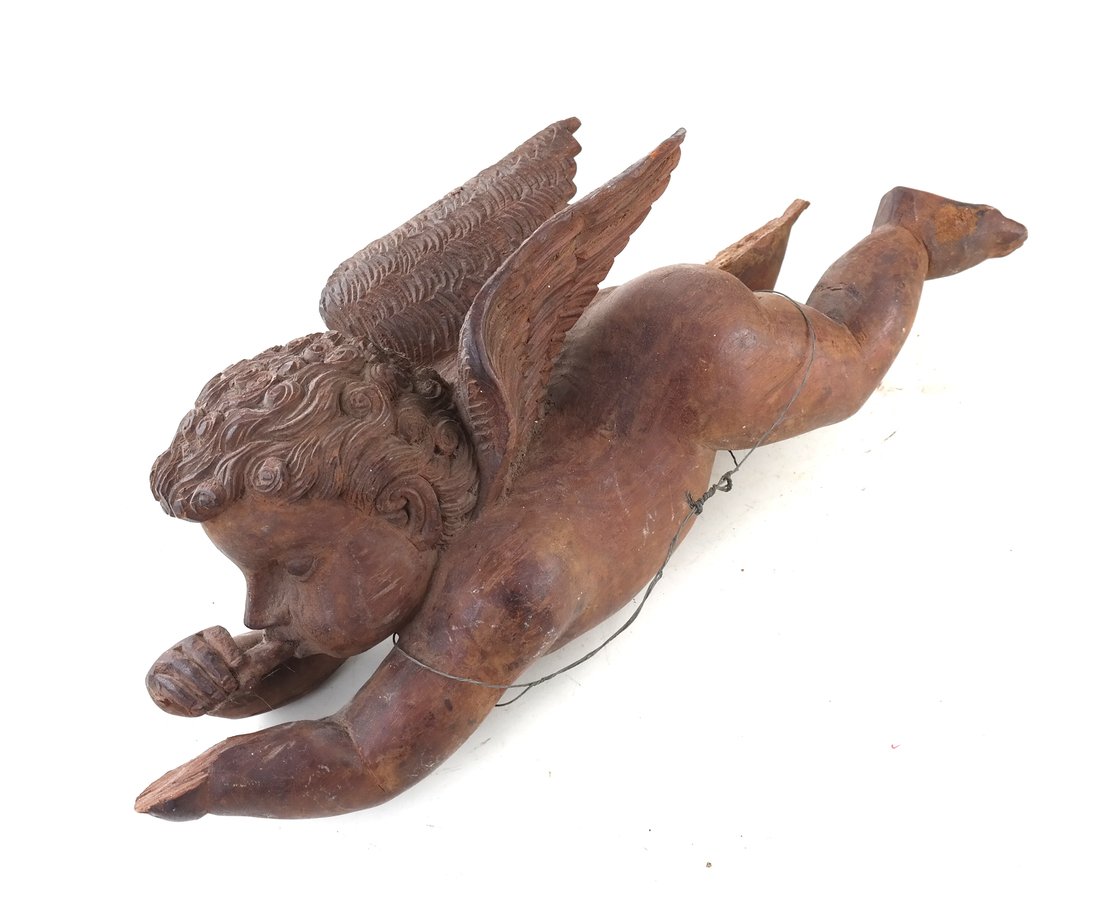 Antique Carved Cupid: Carved cupid, modeled as flying. [7" H x 21" W x 5" D]. Losses to leg. Sold as is.